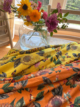Sunflower and daisy floral tablecloth from The Gathering Garden styled with flowers